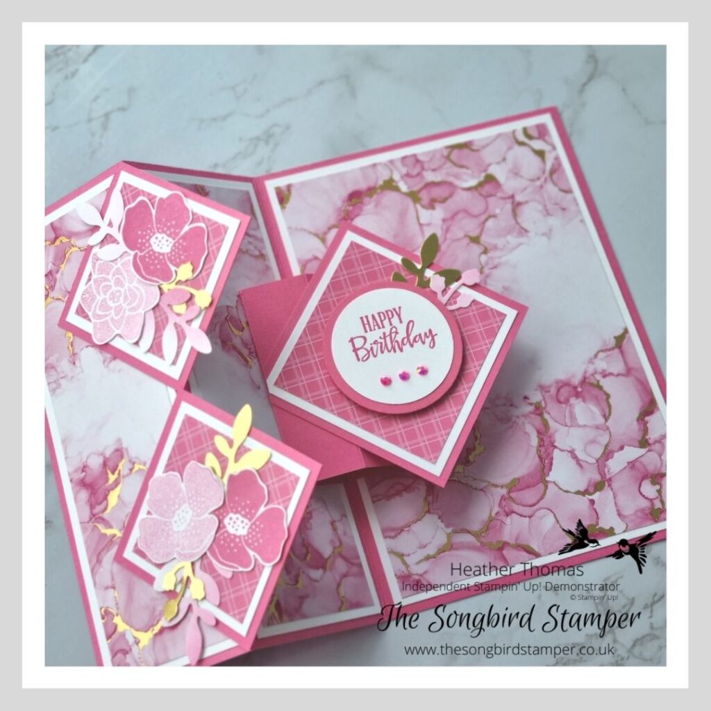 A picture showing a pop-up z-fold card demonstrating Colour Coordination by Stampin' Up! with inks, papers, ribbon and embellishments all in a gorgeous pink colour