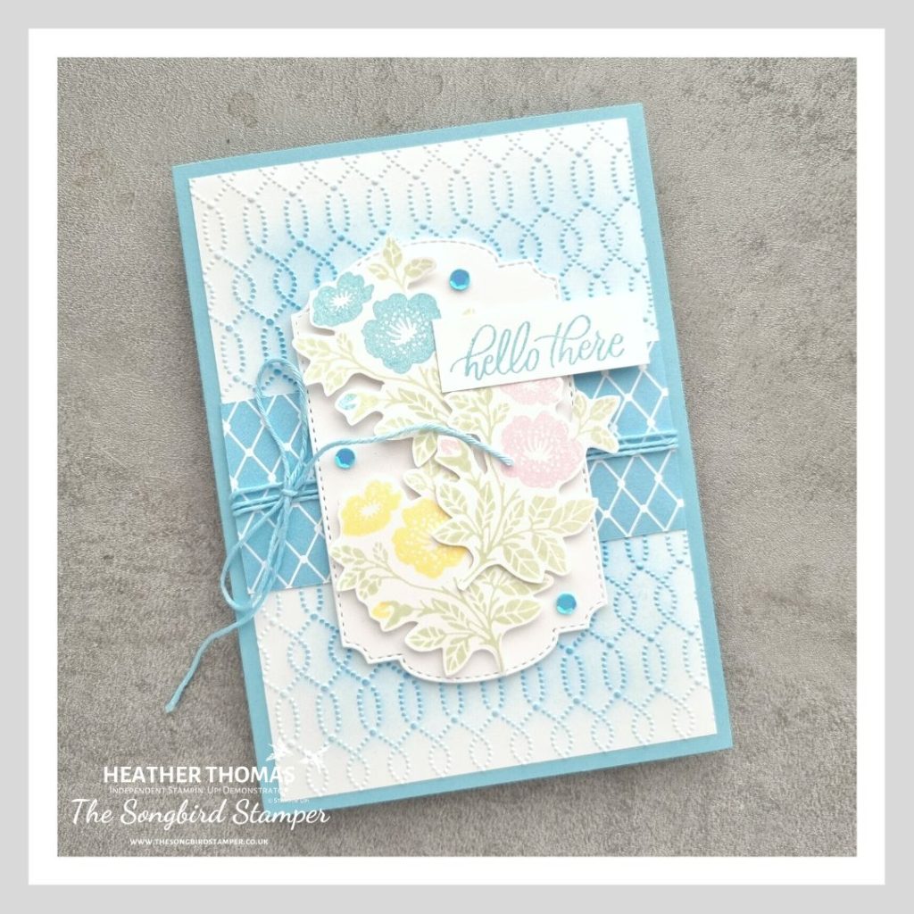 A handmade card in blue, with flowers and the words hello there, using the Softly Sophisticated bundle from Stampin' Up!