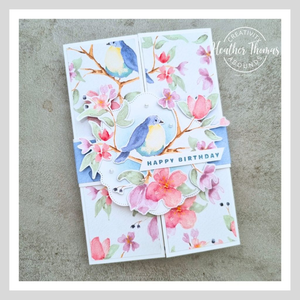 An easy gatefold design handmade card with floral bird images and a belly band.