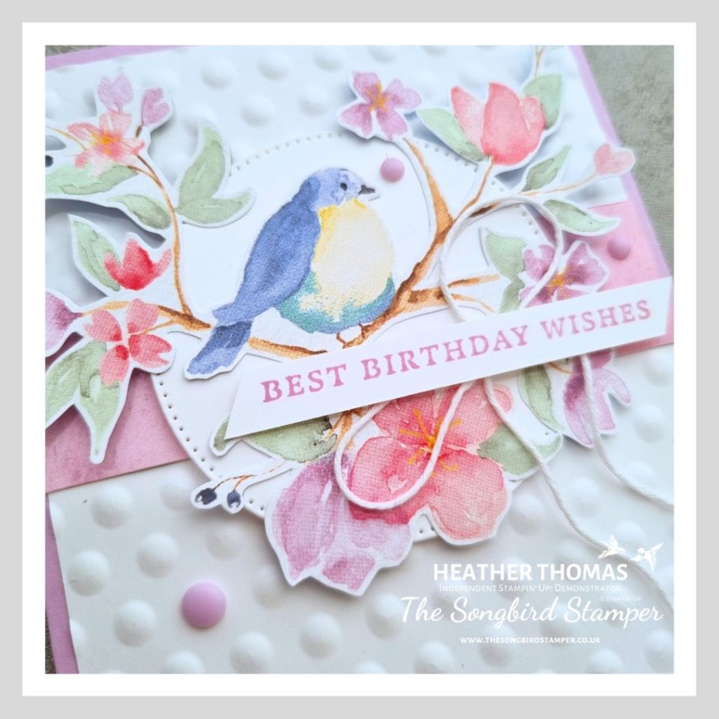 A close up of a handmade card made using the flight and airy DSP from Stampin' Up! with a purple base, a white embossed layer and a focal point of a beautiful bird design