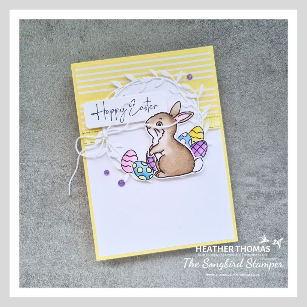 An easy Easter card in yellow and white with a hand coloured rabbit and some easter eggs, with the words Happy Easter