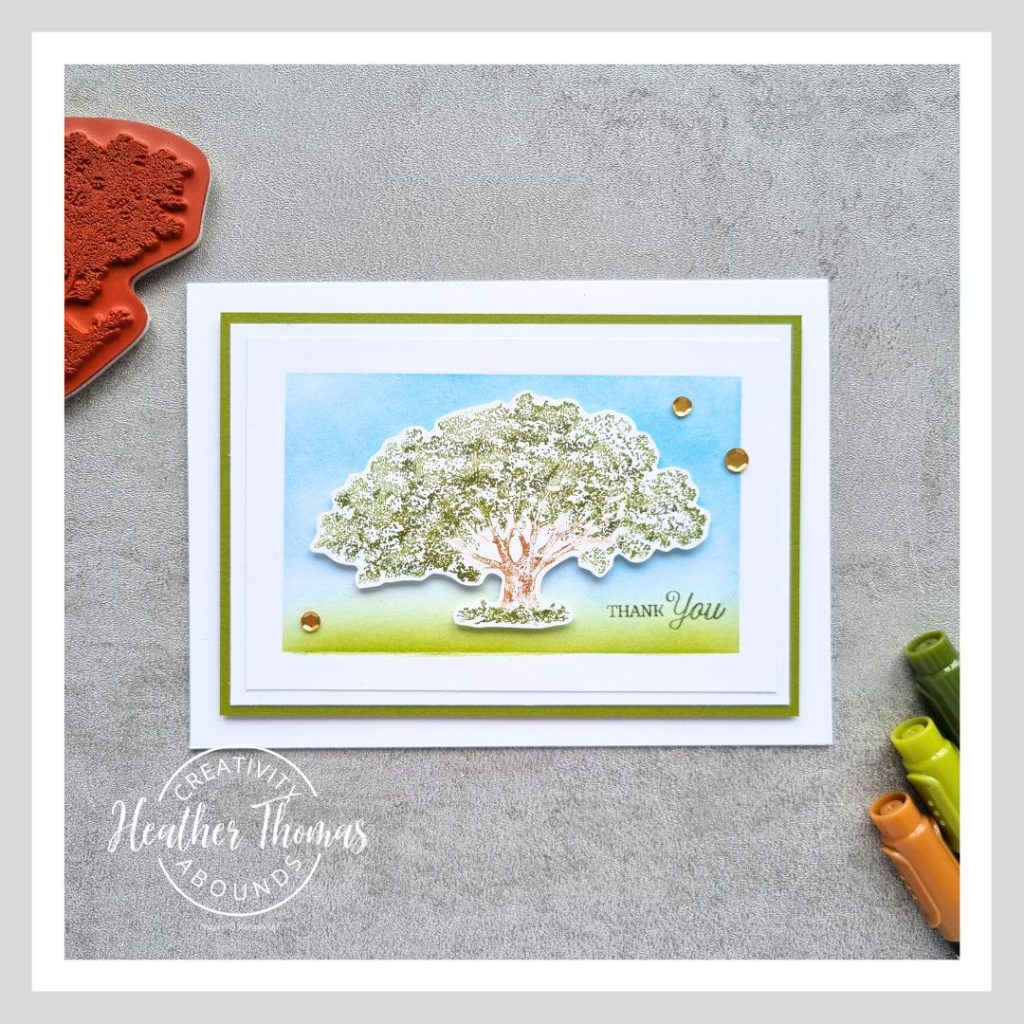 A simple masculine card with an image of a tree on an ink blended background and the word Thank You