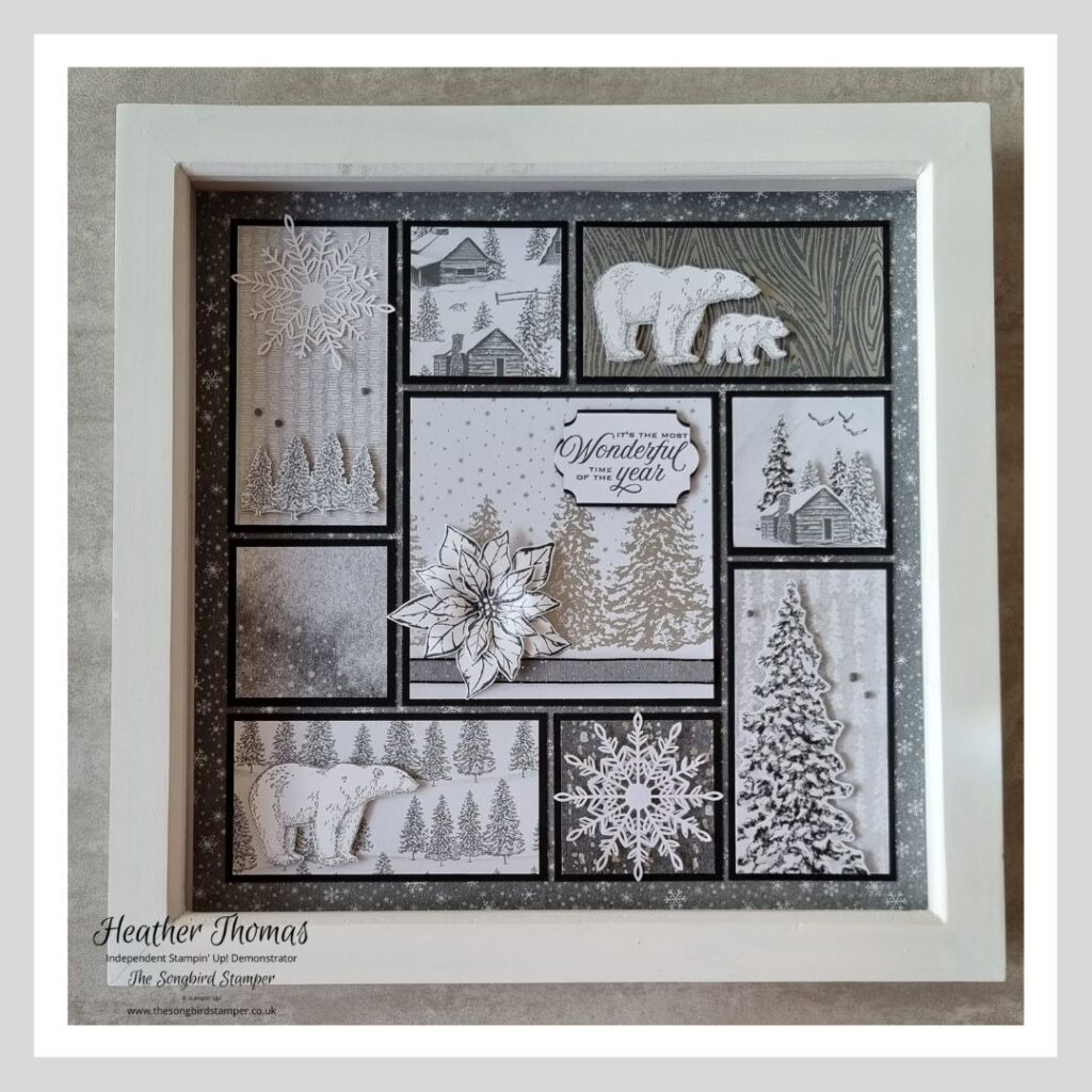 A handmade framed Christmas decoration in a monochrome theme of black, grey and white. 