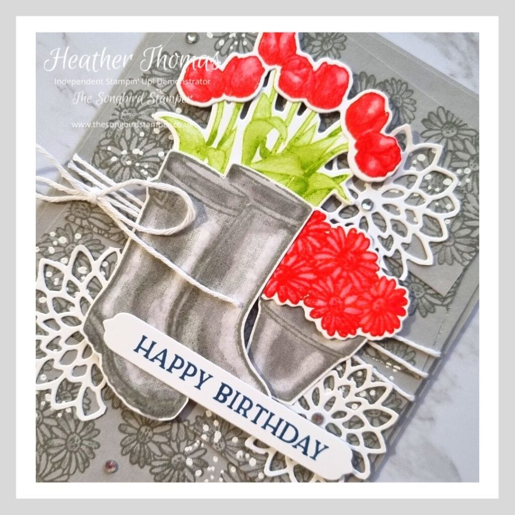 Crafting with a pop of colour, this card has a base of light grey and then a pop of red and green for the main focal point.
