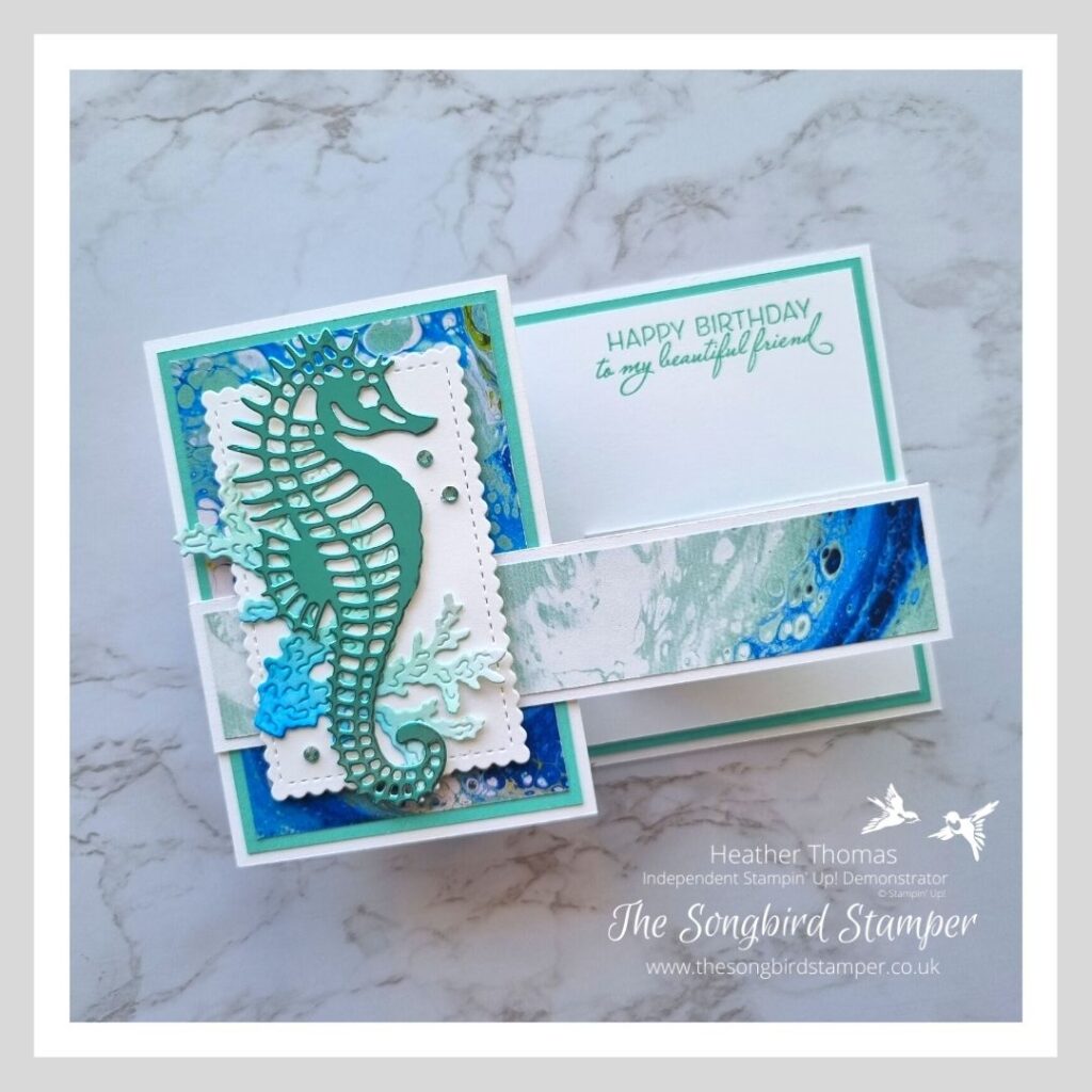 A masculine z-fold card in blues and greens with a gorgeous seahorse on the front. 
