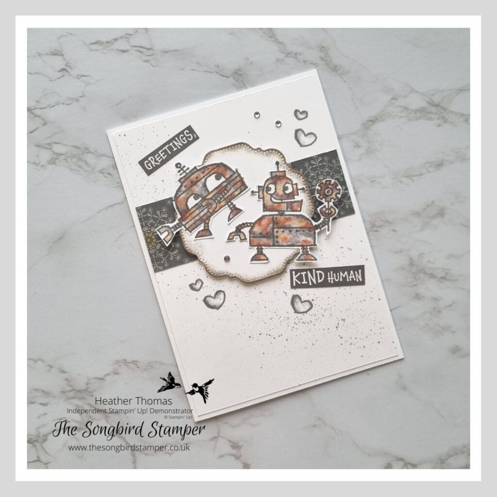 A handmade card with rusty coloured robots on the front, showing how to colour rusty robots