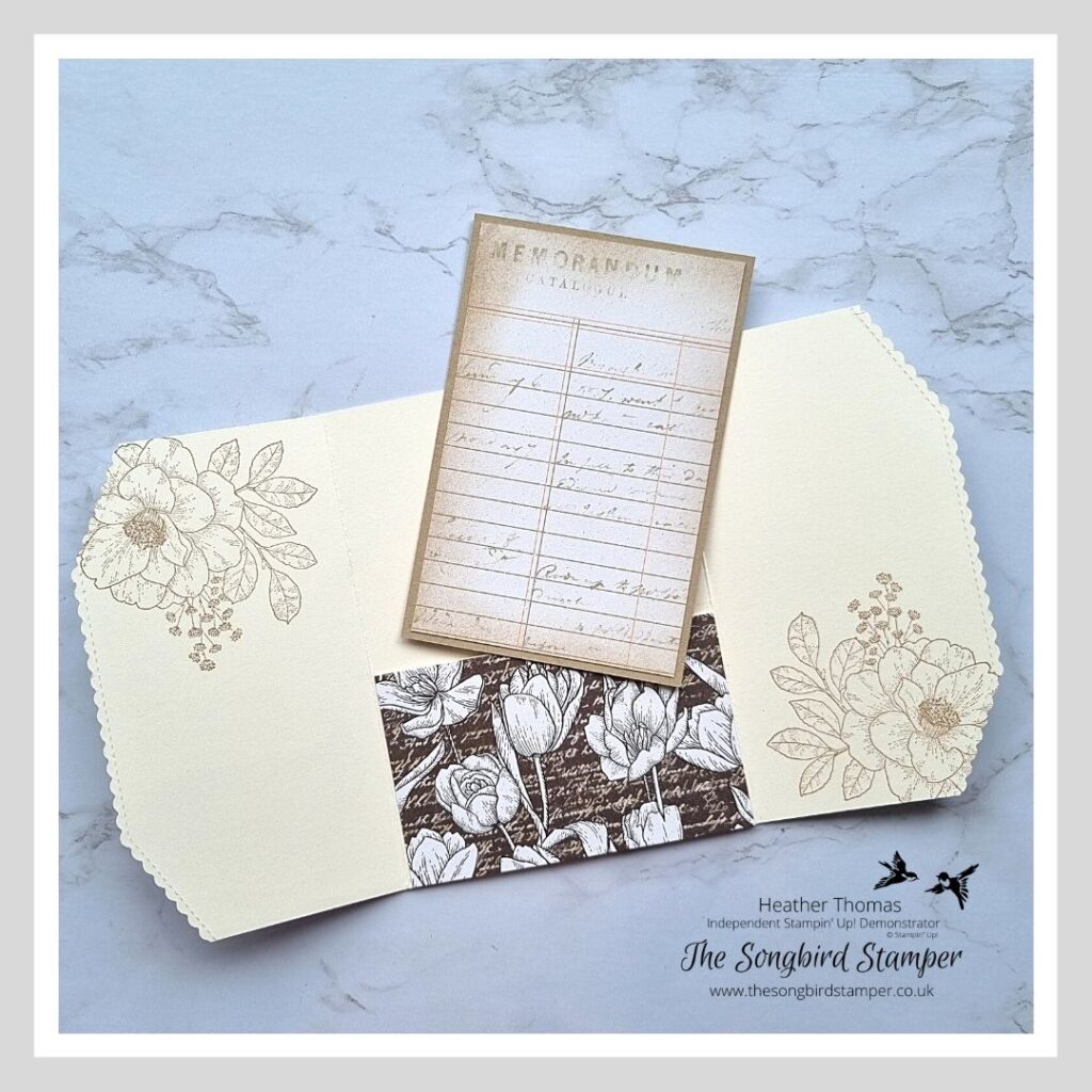 The inside of one of my handmade wedding invitations in cream and brown with flowers and an insert