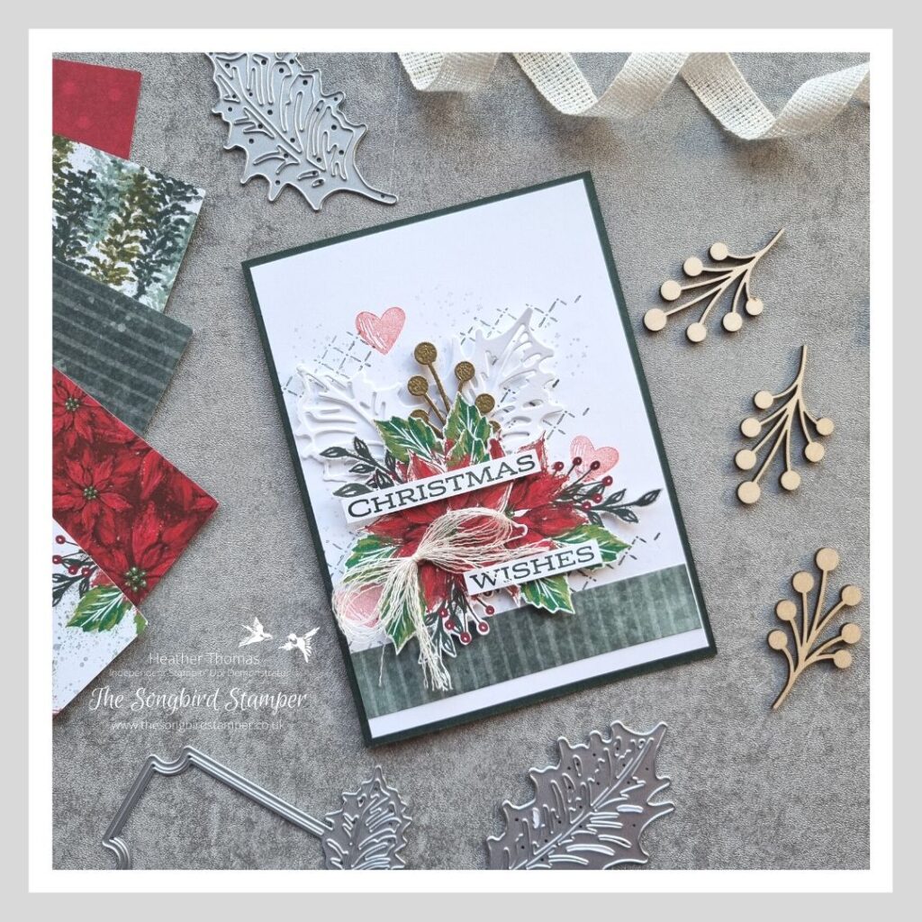 A detailed picture of a Christmas card with Poinsettias and holly leaves, showing all the elements you need to step up a simple card