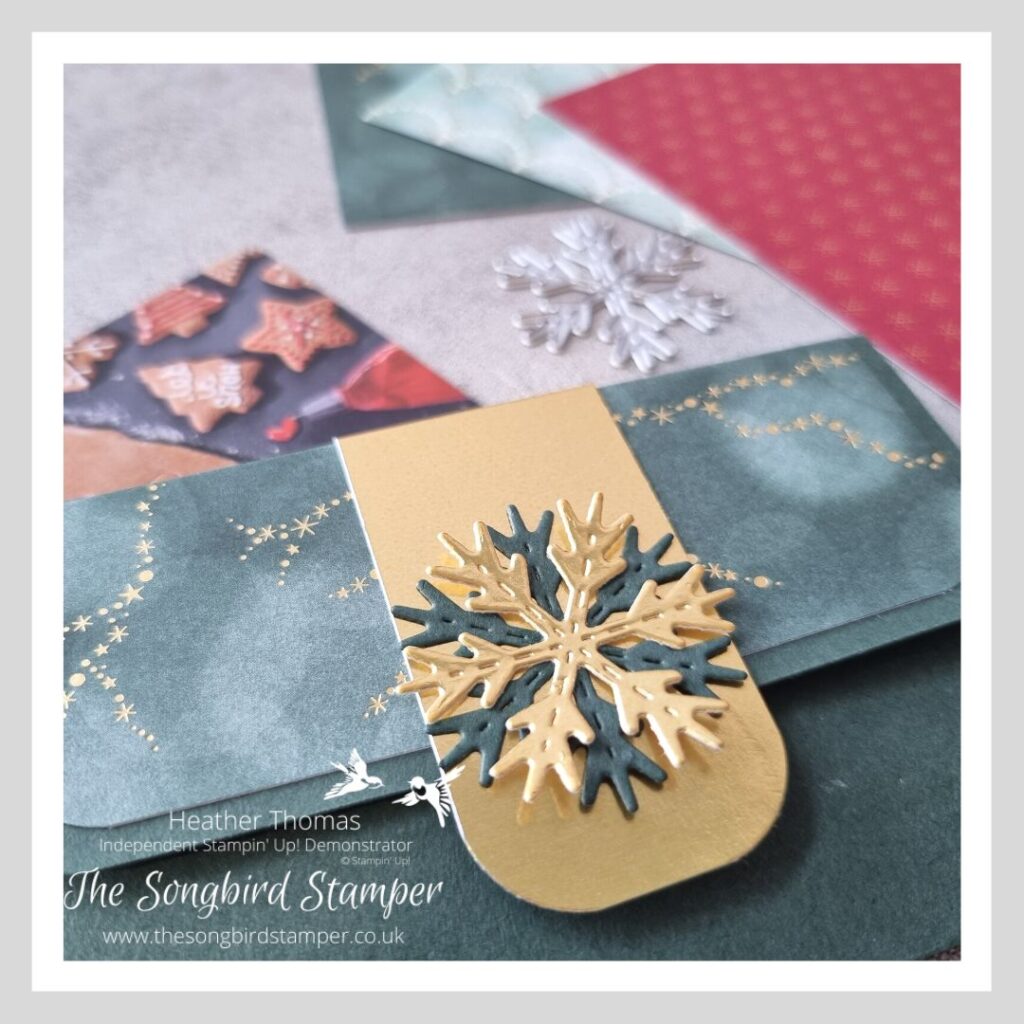 A magnetic gift card holder made in dark green card with foil accents.