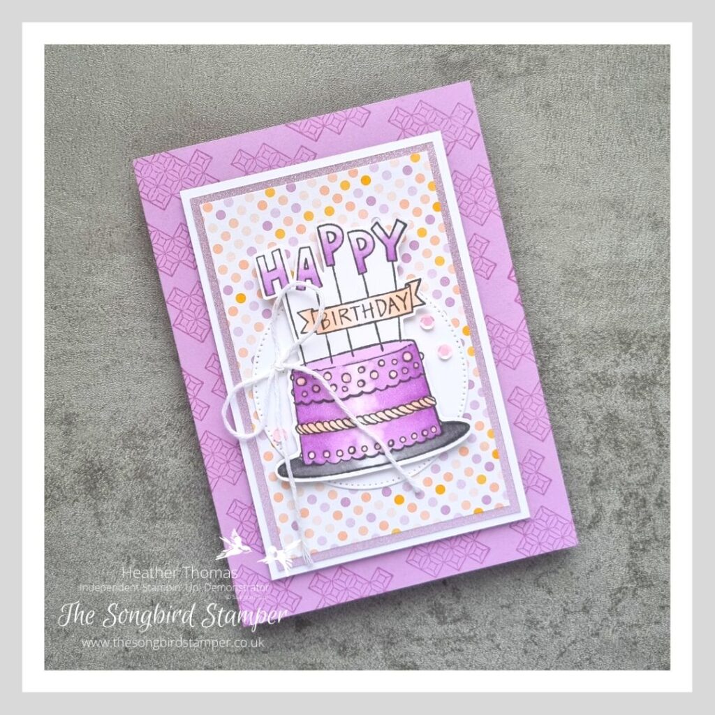 A handmade birthday card using alcohol markers and a gorgeous image of a birthday cake.