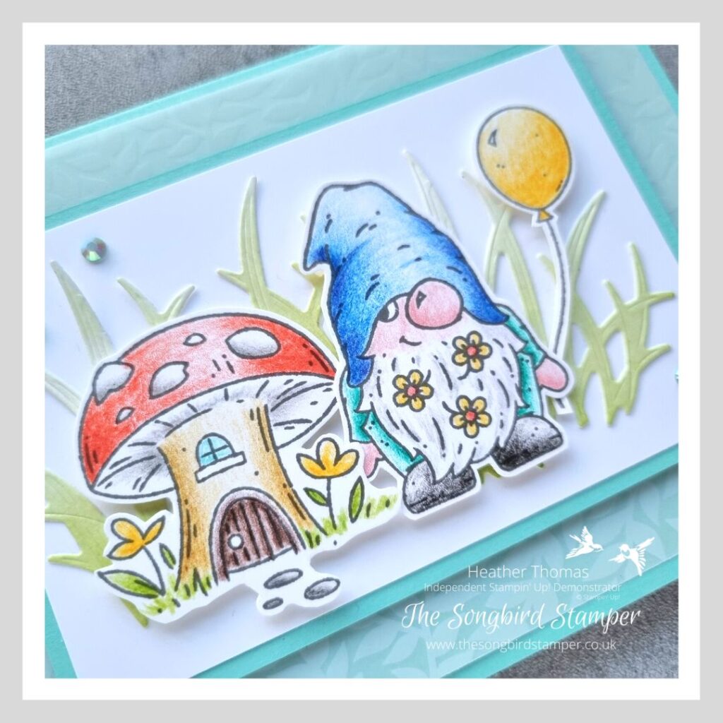 A pencil coloured gnome card in blues and greens, with cute gnome images.