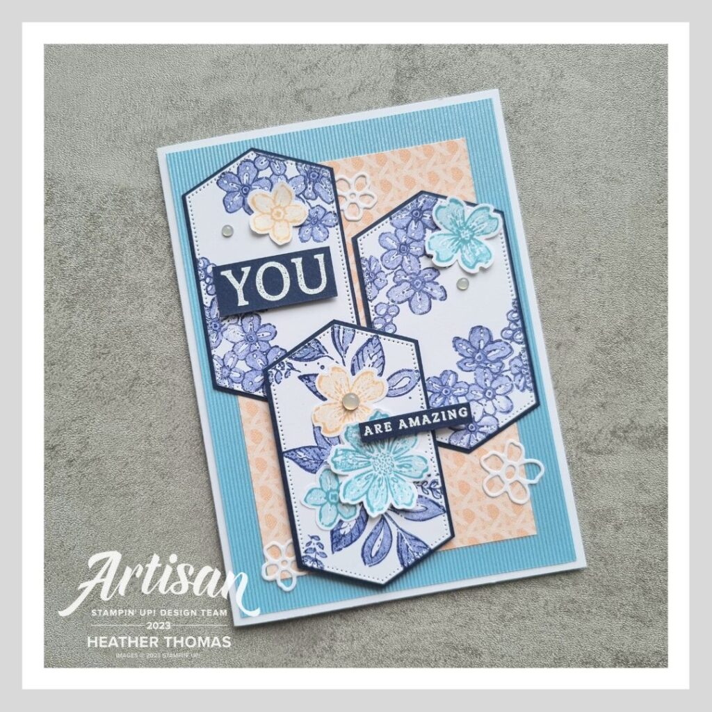 A handmade card with flowers and leaves in blues and pinks, made with the Regency Park Suite of products