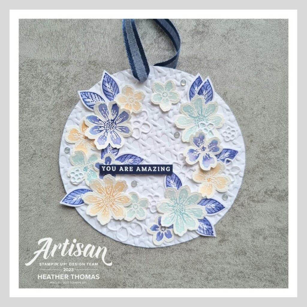 A decorative tag or hanging in blues and whites made with the Regency Park Suite of products