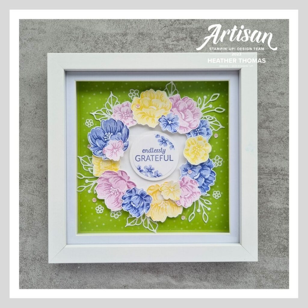 A flower filled box frame in purple, green, yellow, blue and white, all using Stampin' Up! supplies